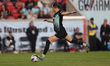 Gotham FC forward Ella Stevens #13 drives and kicks the ball during the National Women's S...