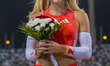 Molly Caudery of Britain celebrates after winning the women's Pole Vault final at the Diam...
