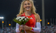 Molly Caudery of Britain celebrates after winning the women's Pole Vault final at the Diam...