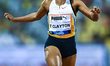 (From left to right) Kambundji Mujinga of Switzerland competes in the women's 100m final a...
