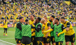 Felix Nmecha of Borussia Dortmund celebrates his team's third goal with teammates during t...
