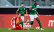 Elvis Mashike Sukisa (right) of Floriana moves away with the ball from the challenge comin...