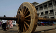 Temple sevayat or traditional chariot makers offer rituals to the newly built wooden wheel...