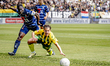 SC Telstar defender Mitch Apau and ADO Den Haag forward Cameron Peupion participate in the...