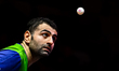 Noshad Alamiyan of Iran competes against Ovidiu Ionescu of Romania during the men's Single...