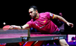 Alberto Mino of Ecuador competes against Benedikt Duda of Germany during the men's Singles...