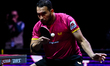 Alberto Mino of Ecuador competes against Benedikt Duda of Germany during the men's Singles...