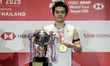 Kunlavut Vitidsarn of Thailand poses with the men's singles trophy after winning against A...