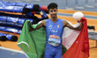 Mattia Furlani of Italy poses with the Italian flag after completing the final of Men's Lo...