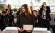Oliver Laxe poses with the Jury Prize (TIE) for ''Sirat'' during the Palme D'Or winners ph...