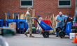 A Kentucky National Guard soldier arranges supplies for locals after an EF-4 tornado carve...