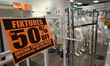 EDMONTON, CANADA, MAY 24:Fixtures 50% sign seen in a nearly empty Hudson's Bay store at S...