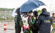 Riders shelter from the rain during the FIM SGP2 Qualifying Round at the Peugeot Ashfield...