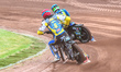 Noel Wahlquist of Sweden in red chases Michael West of Australia in blue during the FIM SG...
