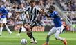 Bruno Guimaraes of Newcastle United and Idrissa Gueye of Everton FC battle for the ball du...