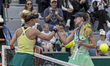 Anna Bondar shakes hands with Laura Siegemund after the match at the Roland Garros Grand S...
