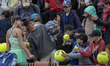 Anna Bondar gives autographs after the match at the Roland Garros Grand Slam Tournament on...