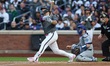 New York Mets player Pete Alonso #20 hits a home run during the first inning of a baseball...