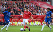 Murillo of Nottingham Forest is under pressure from Moises Caicedo of Chelsea and Enzo Fer...