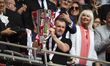 Nathan Jones, manager of Charlton Athletic, holds the trophy during the Sky Bet League 1 P...