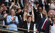 Nathan Jones, manager of Charlton Athletic, lifts the trophy during the Sky Bet League 1 P...