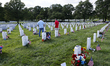 Visitors are in Arlington National Cemetery on Memorial Day in Arlington, Virginia, on May...