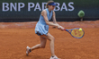 Cristina Bucsa returns the ball against Mirra Andreeva at the Roland Garros Grand Slam Tou...