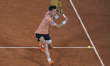 Fabian Marozsan returns the ball against Carlos Alcaraz at the Roland Garros Grand Slam To...