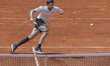 Alexander Bublik returns the ball against Alex De Minaur at the Roland Garros Grand Slam T...