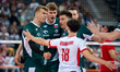 Poland players celebrate after scoring a point during the volleyball match between Poland...