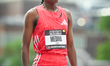 Eisa Medina of Ethiopia stands at the finish line after finishing fourth in the Women's 30...