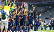 Marquinhos of Paris Saint-Germain raises the trophy after winning the UEFA Champions Leagu...