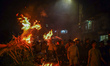 Hindu devotees welcome the god Rato Machindranath with barley straw fire during the Bhoto...