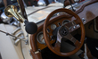 A steering wheel of a Mercedes car is on display at the exhibition of vintage cars in Novi...