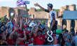 Second-placed UAE Team Emirates XRG's Mexican rider Isaac Del Toro greets a group of Mexic...