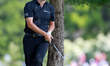 Patrick Cantlay of the United States looks toward the green after hitting from the rough o...
