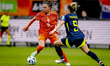 Netherlands forward Romee Leuchter and Scotland defender Sophie Howard play during the mat...