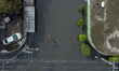 An aerial view shows flooded streets near the La Colmena pumping plant on the border betwe...