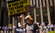 Protesters hold signs and chant outside of Fox News headquarters in New York City, USA, on...