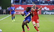 Sherly Jeudy #9 of Haiti and Gabrielle Carle #21 of Canada battle for the ball during the...