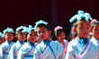 Kids attend a first writing ceremony, also called Qi Meng (Enlightenment) ceremony, at the...
