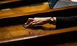 An MP deputy votes during the session to adopt the bill for the payment of family allowanc...