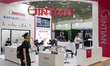 Visitors explore products on display at JINTIAN's booth during EV Trend Korea 2025, the na...