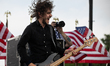 Dropkick Murphys guitarist Kevin Rheault performs with the band at a rally for veterans on...