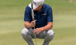 Steve Stricker squats down to rest on hole 7 during round 1 of The American Family Insuran...