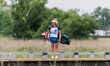 Nicki Stricker, Steve Stricker's wife and caddie, waits on a bridge leading to hole 9 duri...