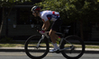A participant warms up before the start of the cycling race on Bulevar Mihajla Pupina in N...