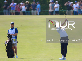 CALEDON, ONTARIO - JUNE 07: Cristobel Del Solar of Jupiter, Florida hits from the 15th fairway next to his caddie  during the third round of... by Amy Lemus/NurPhoto
