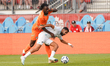 Evann Guessand #20 of Cote D'Ivoire and Sarpreet Singh #10 of New Zealand battle for the b...