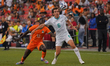 Mohamed Diomande #12 of Cote D'Ivoire and Joe Bell #6 of New Zealand battle for the ball d...
